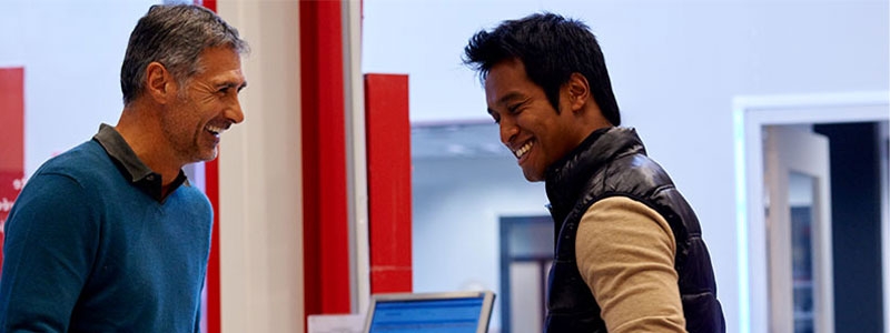 A person smiling at a computer